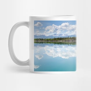 Yukon wilderness cloudscape reflected on calm lake Mug